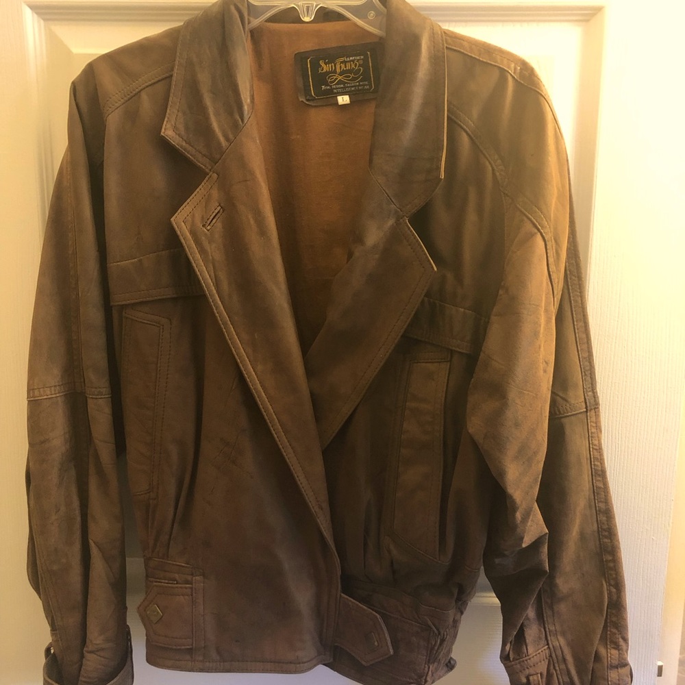Vintage leather jacket, stylish, distressed.